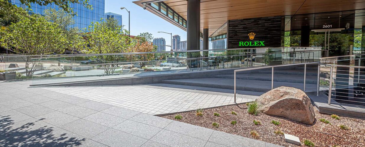 sidewalk view of Rolex Plaza front entrance